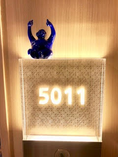 Syd (in revolving colors) maintains a position above our stateroom number.